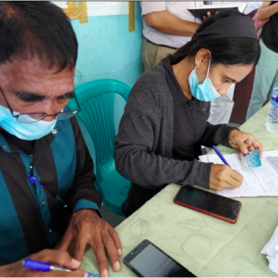 Government officials at Suko Tibar in Liquica Municipality are checking records and entering data before cash subsidies are handed over to the beneficiaries. 