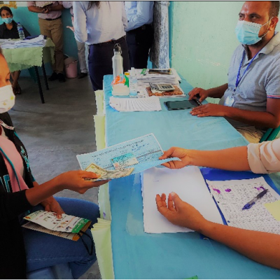 A beneficiary in Liquica Municipality is receiving USD200 subsidy on account of Government of Timor-Leste’s cash transfer programme to support low-income households during COVI19. 